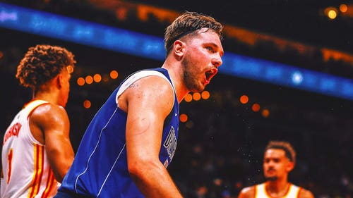 NBA Trending Image: Luka Doncic objects Mavericks document with 73-level night